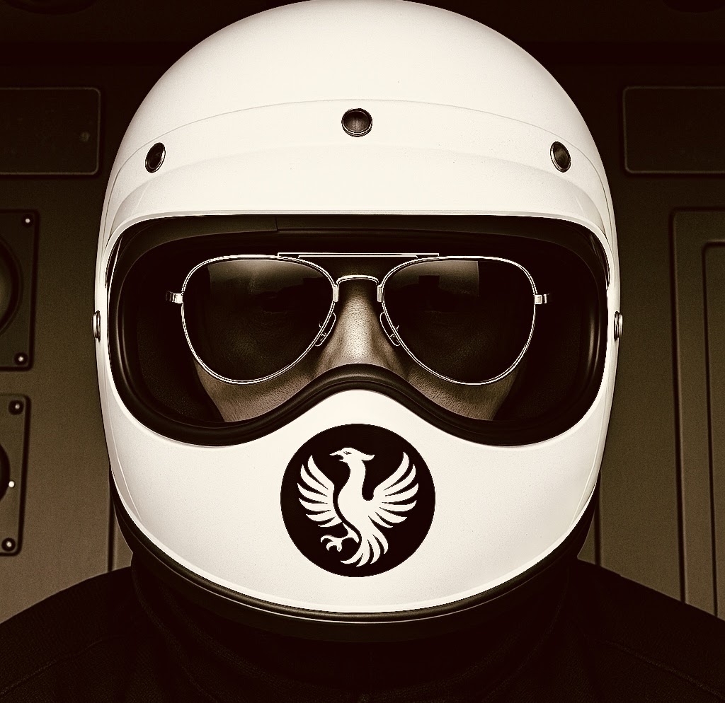 Portrait of Jay Davidsound (JDVS) wearing a white motorcycle helmet and dark glasses